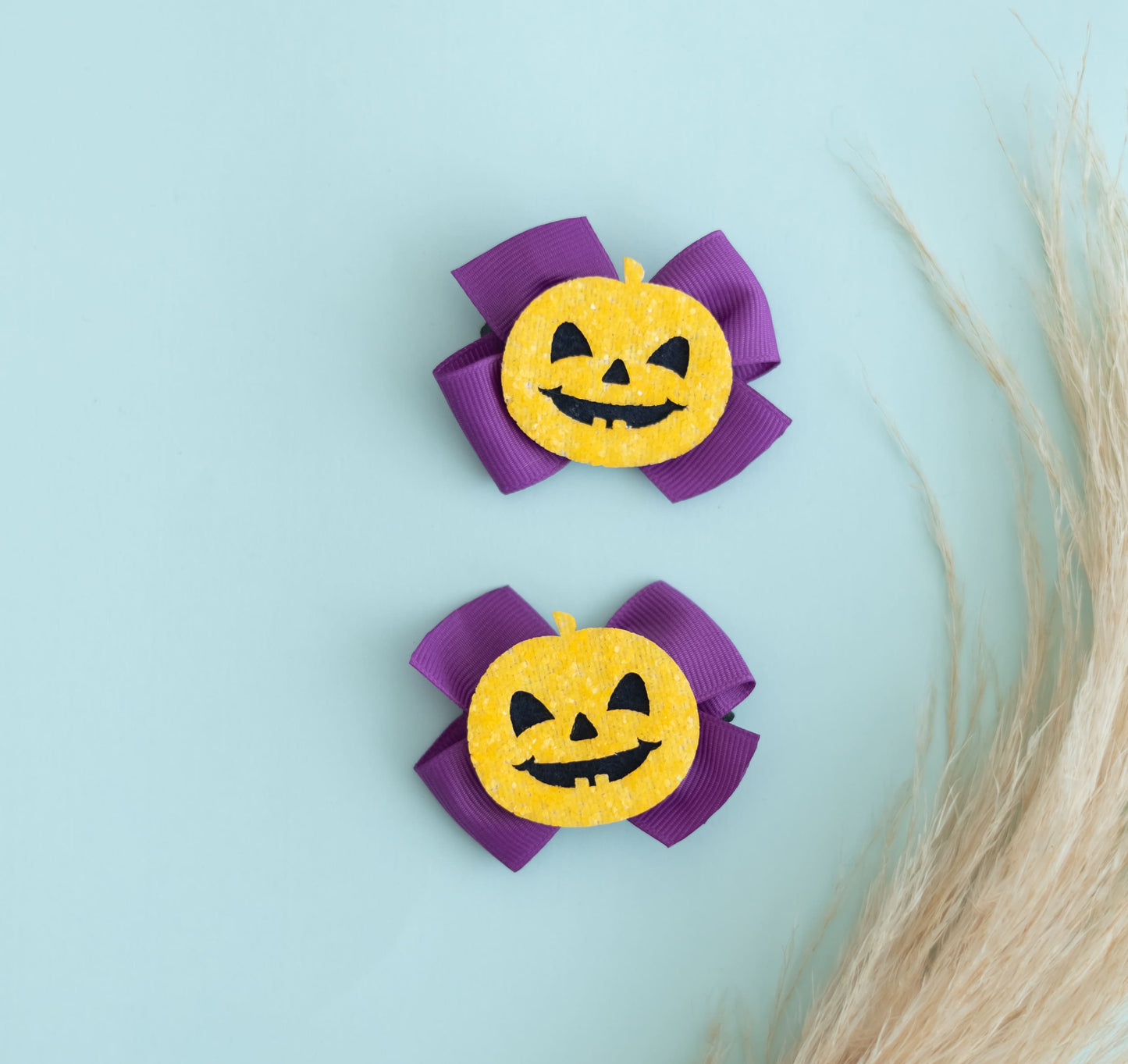 Halloween: scary pumpkin ghost face on cute hair bows (Set of 2 clips)- Purple, Orange