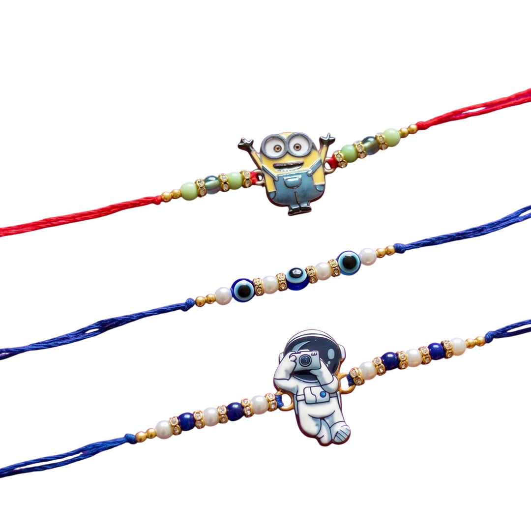 Ribbon Candy set of 3 Rakhi-Cartoon, Astronaut Charms and Evil Eye Beads- Blue, Red