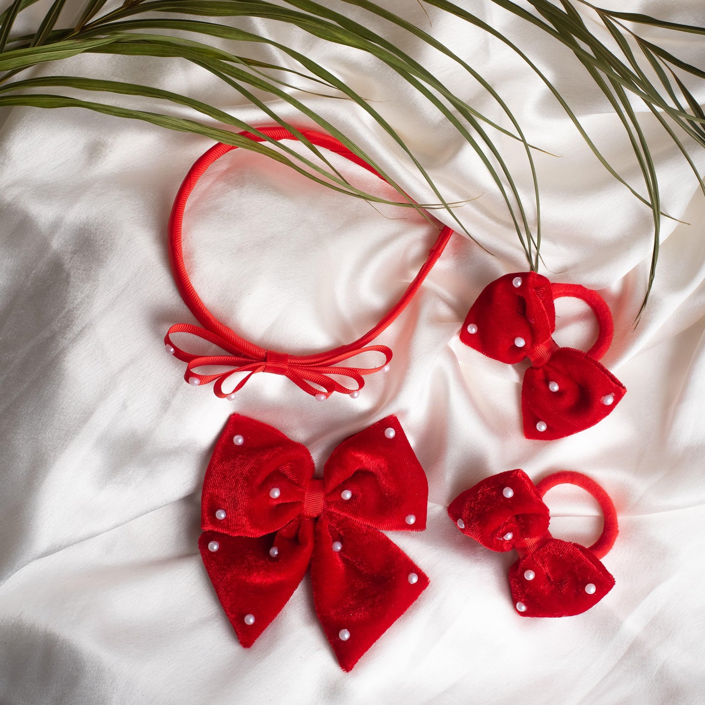 Ribbon Candy- 1 Velvet bow on aliigator clip , 1 pair rubberbands (2 nos) and 1 loopy hairband with pearl detail combo- Red