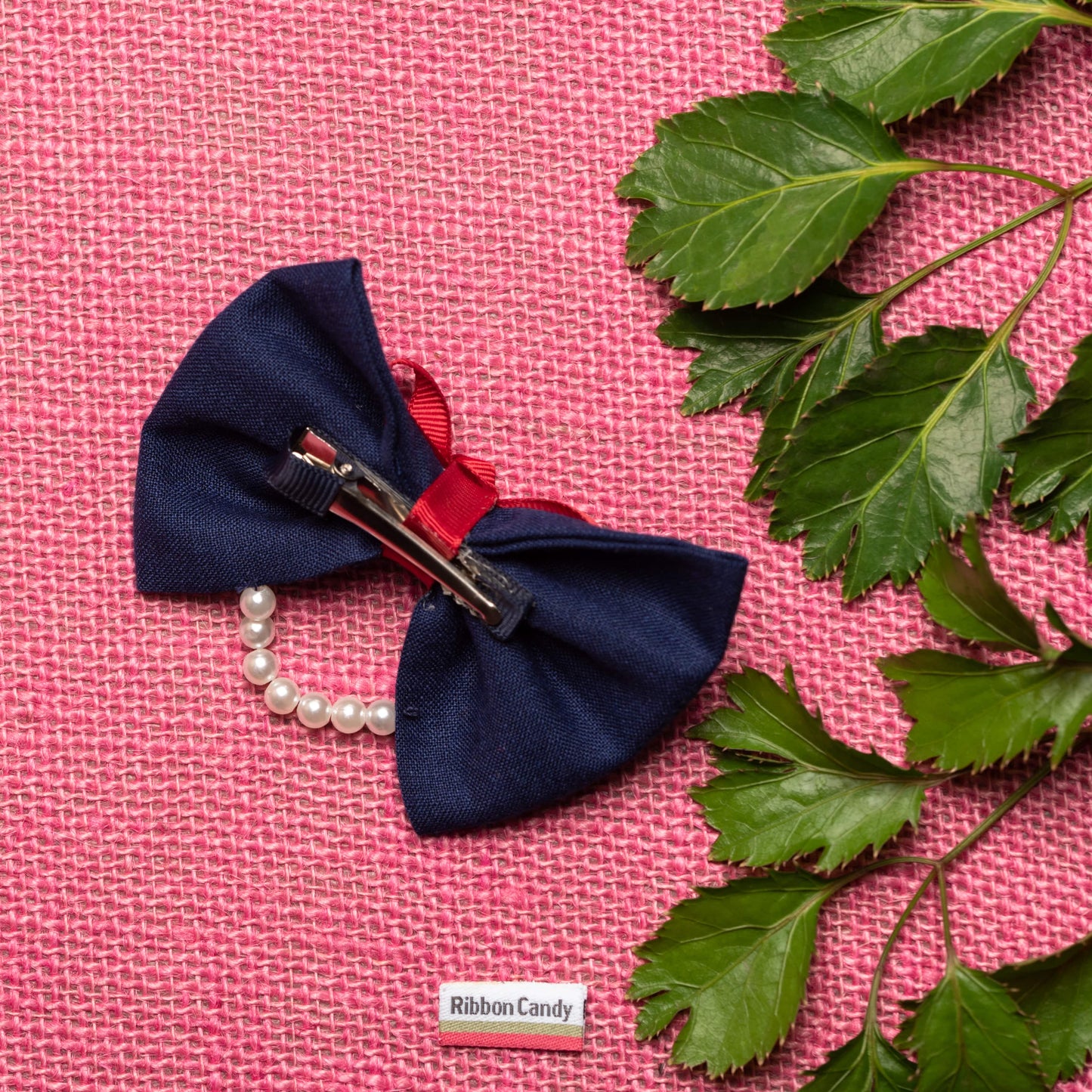 Dual Bow with Pearl Detailing on Alligator Pin - Blue and Red