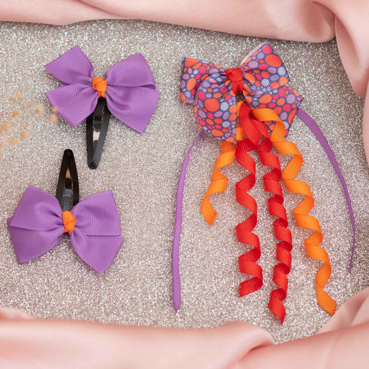 Combo: Cute dangler on alligator clip along with cute and fancy bow on tic-tac pins - Purple, Red, and Orange