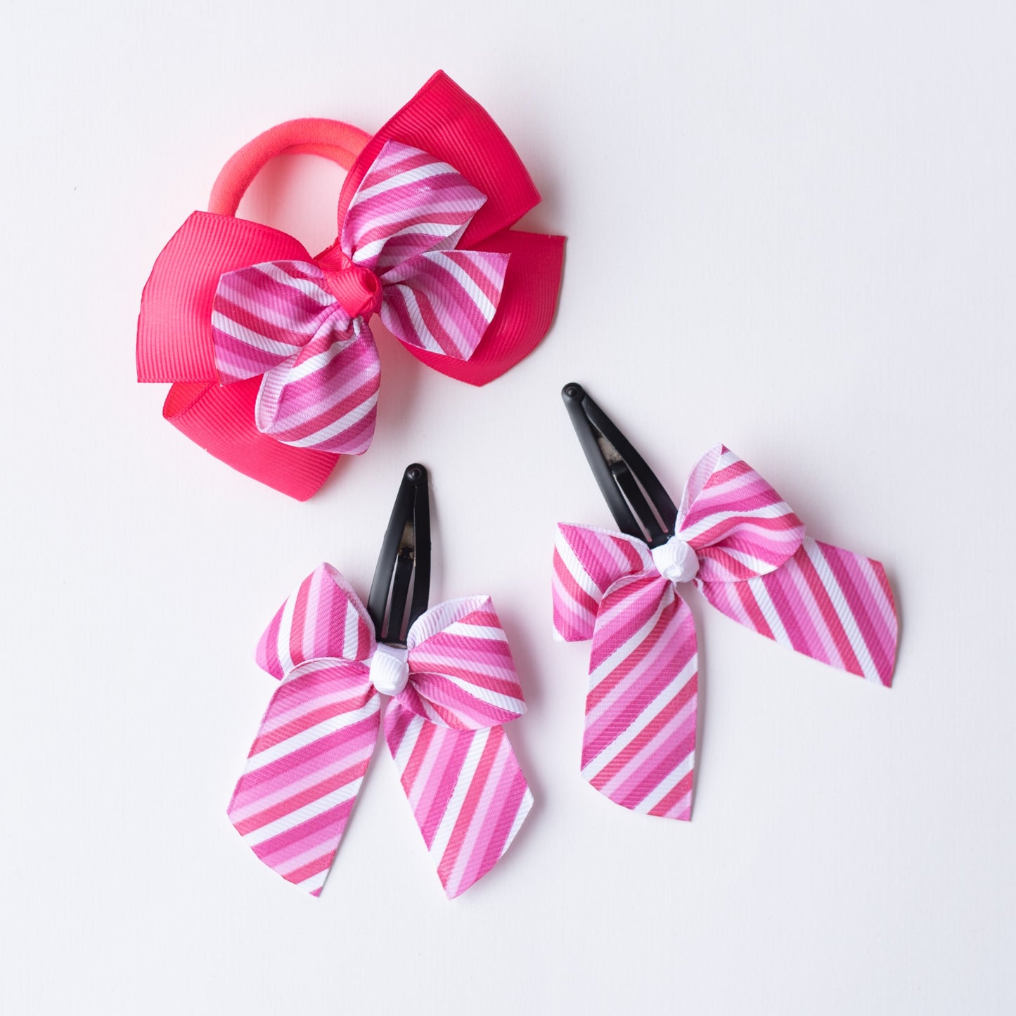 Combo: Cute striped print bow on tic-tac pins and dual bow rubberband - Pink