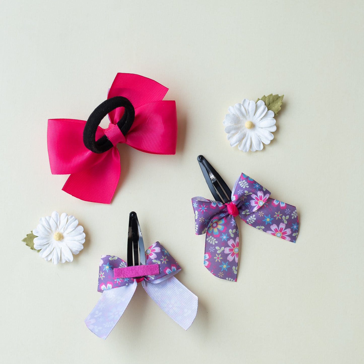 Combo: Cute flower print bow on tic-tac pins  (2 nos) and dual bow rubberband -Purple and Pink