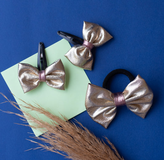 Combo: Fancy gold shiny bow on tic-tac pins and one matching rubberband - Gold