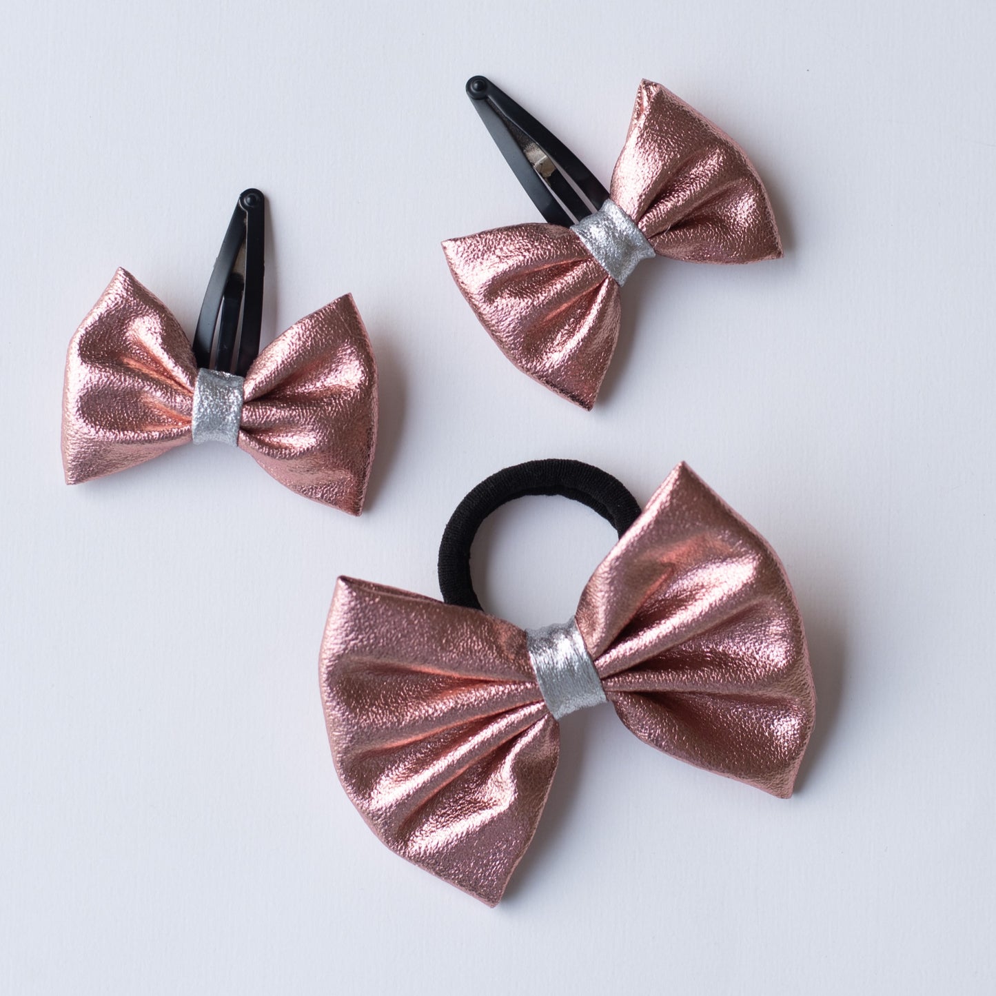 Combo: Cute Tissue Fabric Bow on Tic-Tac Pins and Rubberband (3 nos)- Rose Gold.