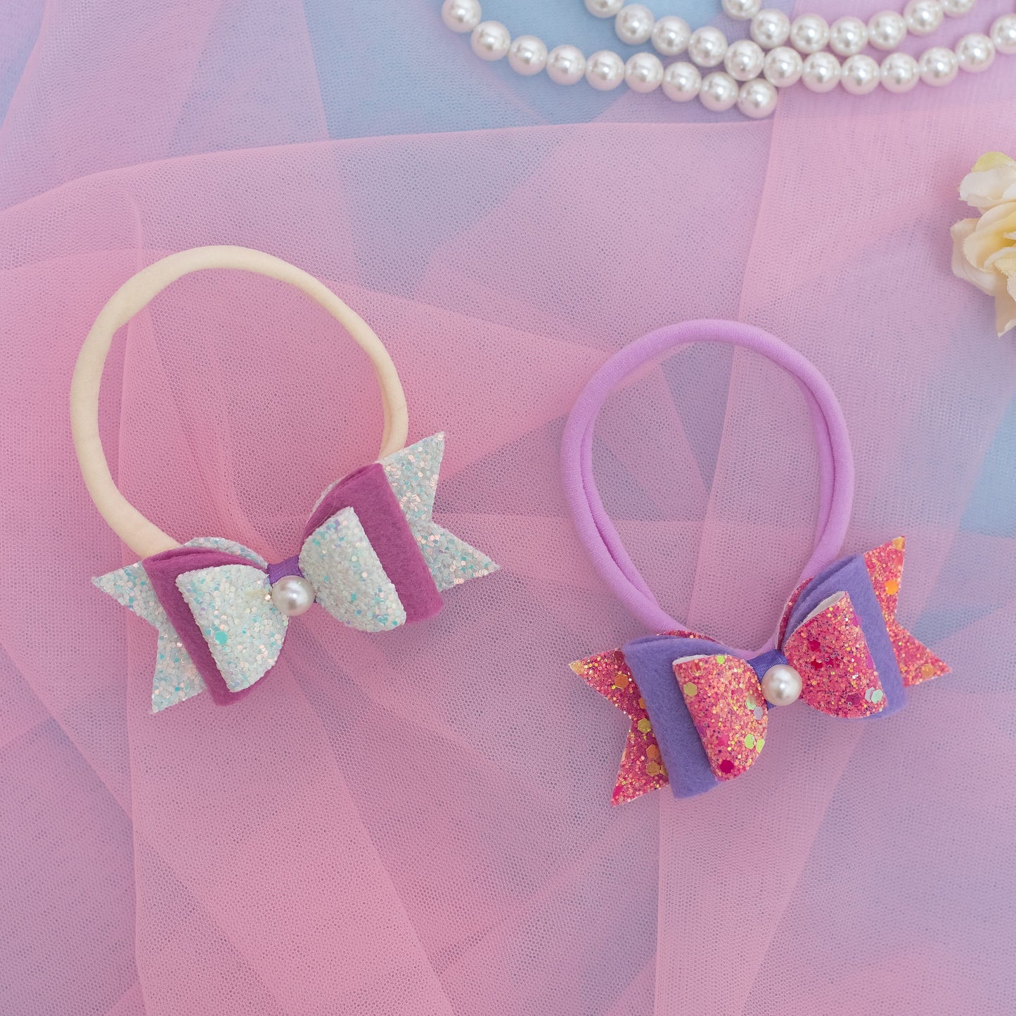 Combo: 2 Super Soft Infant Stretchy Bands with Glitter Bows on each - Pink, Aqua (Set of 2 Stretchy Bands)
