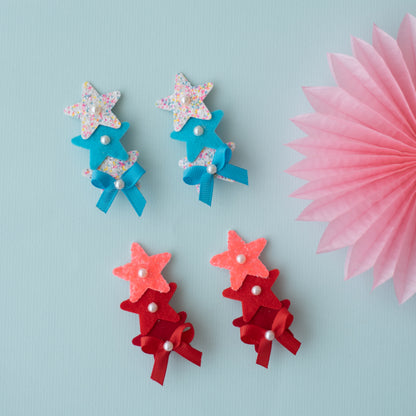 Combo :  Set of 2 cute glitter star alligator clips embellished with pearls and small bows  - White, Blue, Red