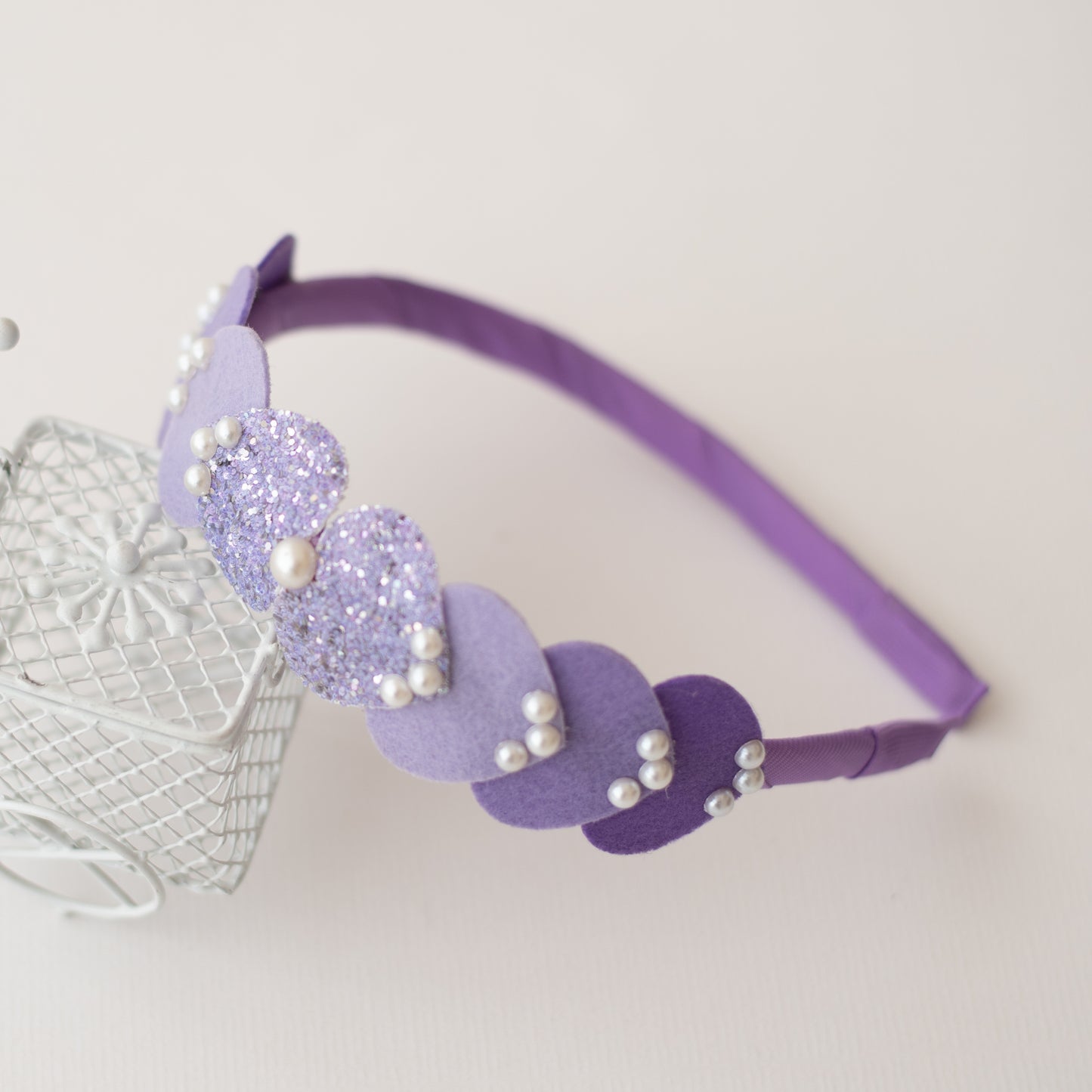 Dainty hairband with cascading hearts and pearl detailing -Purple
