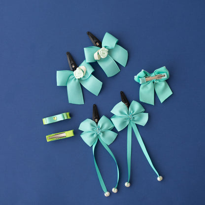 Combo: 1 pair dangling tic-tac clips, 1 pair small loopy alligator pins, 1 pair bow tic-tac clips embellished with roses, and 1 velvet bow on alligator clips - Sea green
