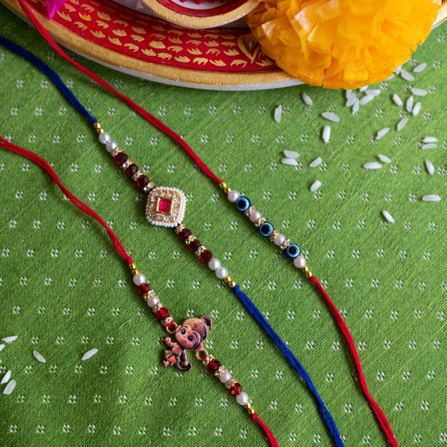 Set of 3 Rakhis, Little Hanuman, Evil Eye & Kundan Charm - Multicolor