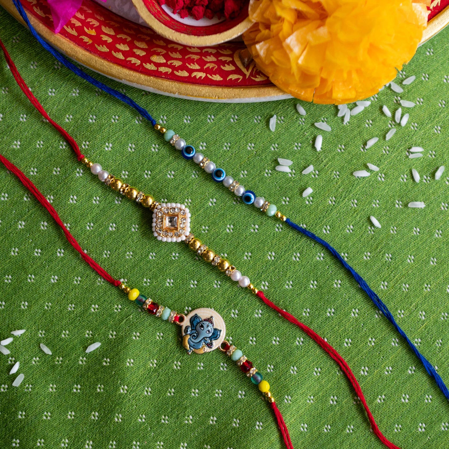 Ribbon Candy Set of 3 Rakhis- Ganesha, Kundan Charm & Evil Eye Beads- Multicolor
