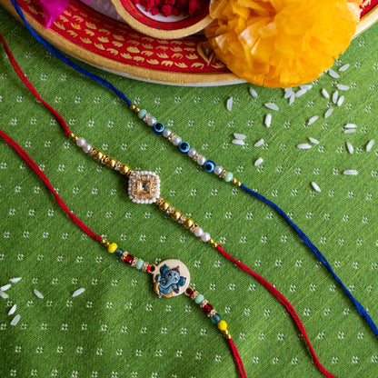 Ribbon Candy Set of 3 Rakhis- Ganesha, Kundan Charm & Evil Eye Beads- Multicolor