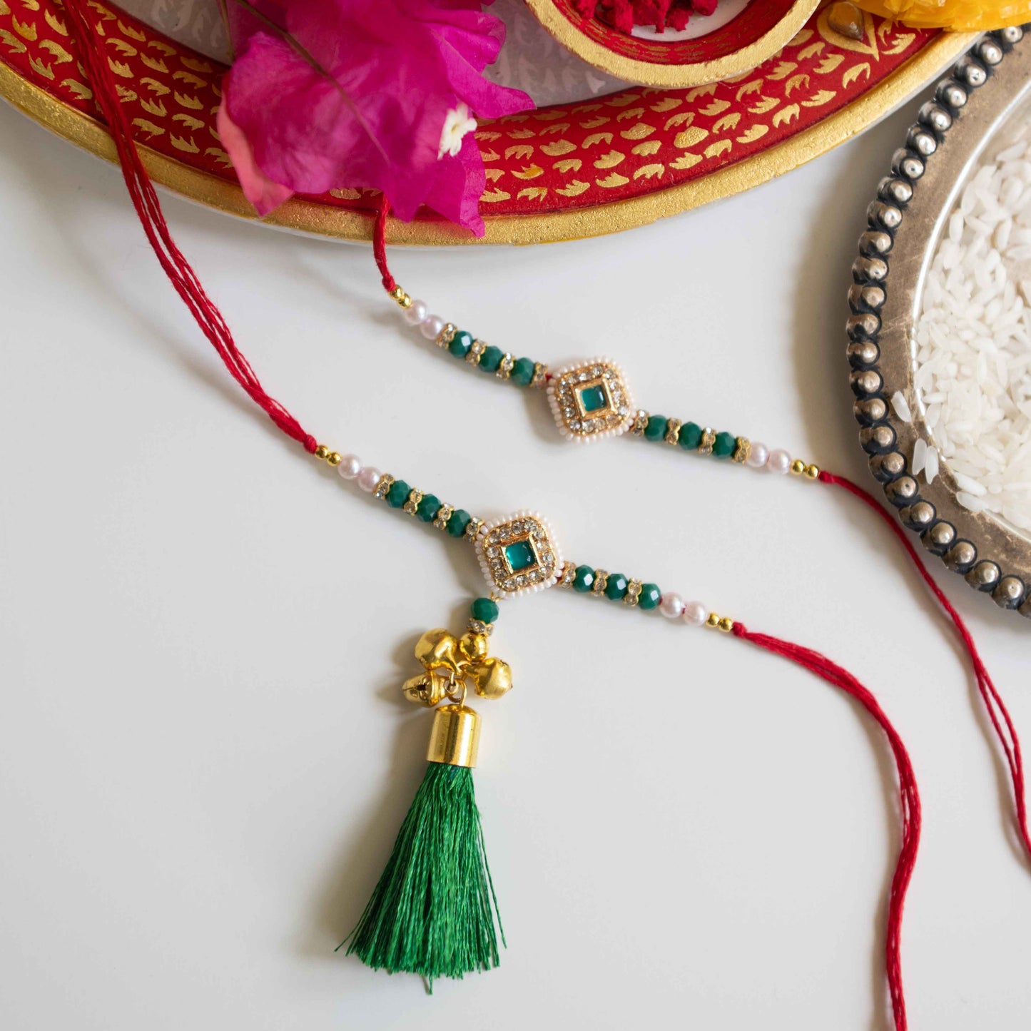 Ribbon Candy Set of 2 Rakhis-Bhai Bhabhi's kundan Charm- Green, Red
