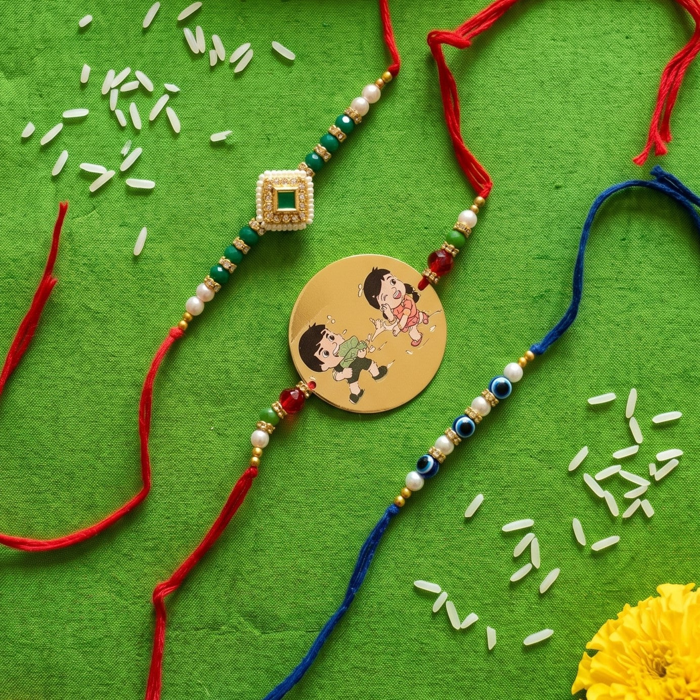 Ribbon Candy Set of 3 Rakhi-Metal, Kundan Charm and Evil Eye Bead– Red & Blue