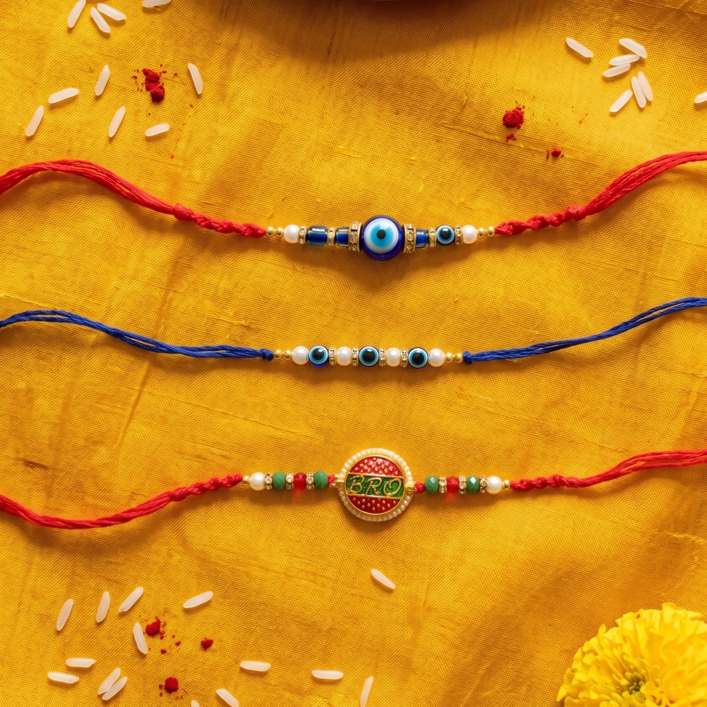 Ribbon Candy Set of 2 Rakhis- 'Bro' Charm Rakhis & Evil Eye Beads – Blue & Red
