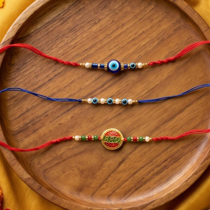 Ribbon Candy Set of 2 Rakhis- 'Bro' Charm Rakhis & Evil Eye Beads – Blue & Red