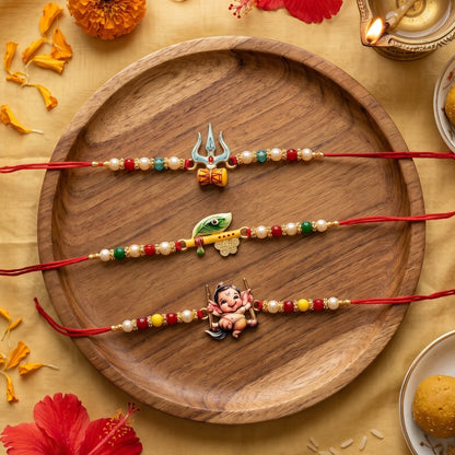 Ribbon Candy Set of 3 Rakhi-Handmade Lord Ganesha, Trishul and Peacock Feather Charms- Red