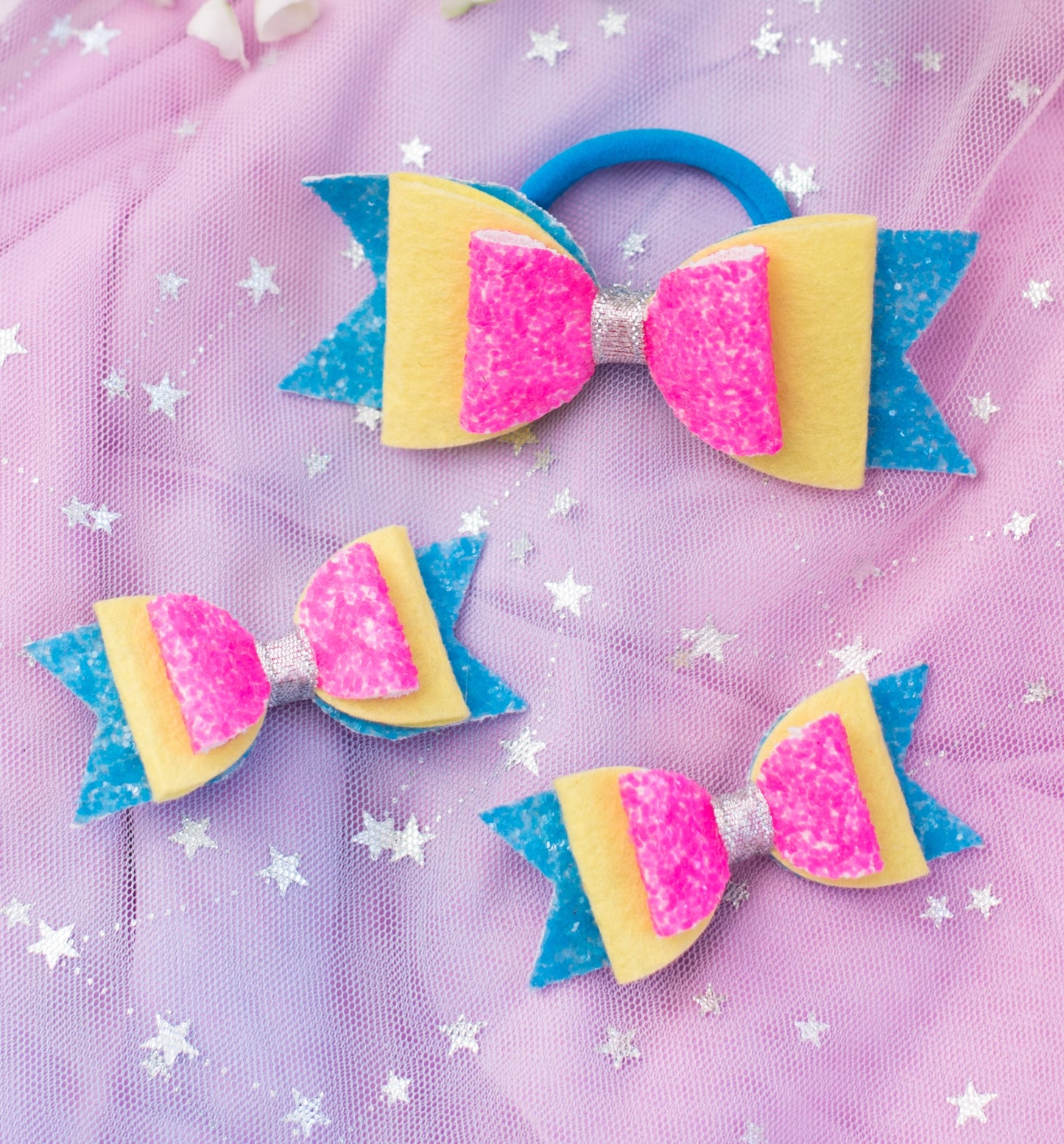 Fancy glitter bow on Alligator  pins (2 nos) and Cute Big Rubber bow- Blue, pink, yellow and Silver