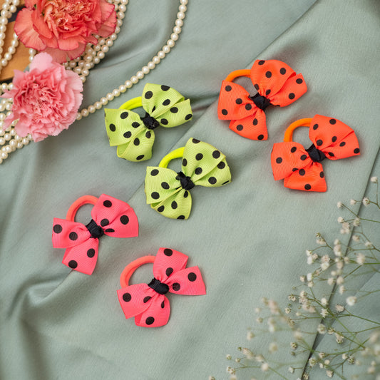 Dainty and appealing  fluorescent polka dotted bow on rubberbands- Multicolor (Set of 3 pairs - 6 quantity)