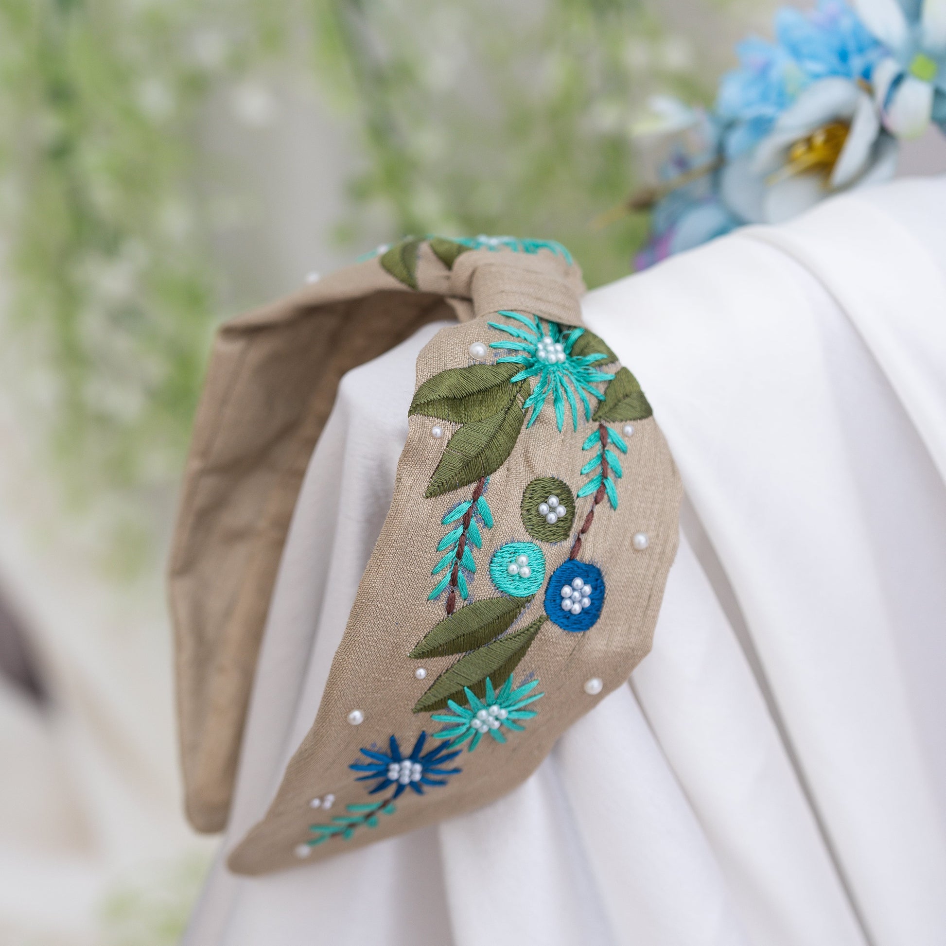 Ribbon Candy- Multicolour thread embroidered Floral Motif Hairband with Pearl Detailing- Beige and Blue