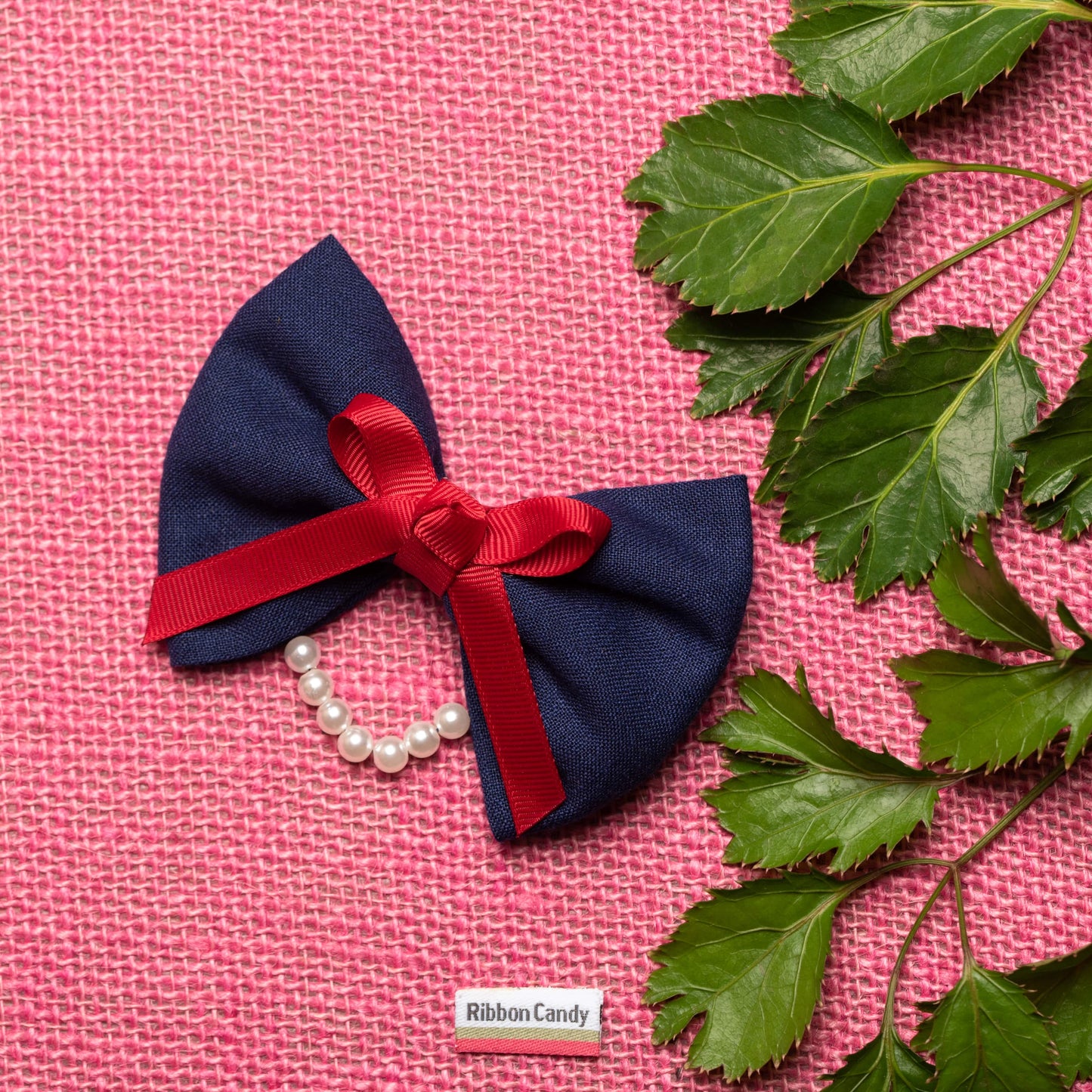 Dual Bow with Pearl Detailing on Alligator Pin - Blue and Red